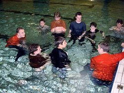 swimming lesson teacher students